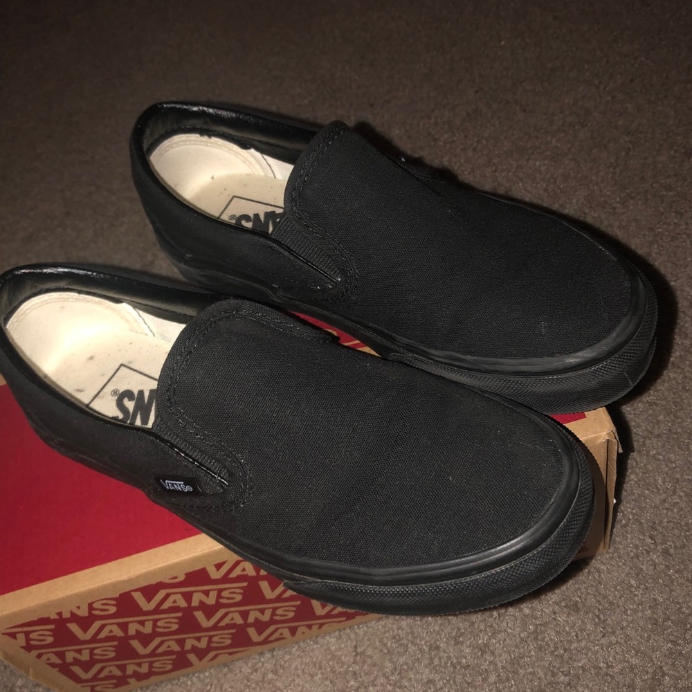 All black slip on vans.